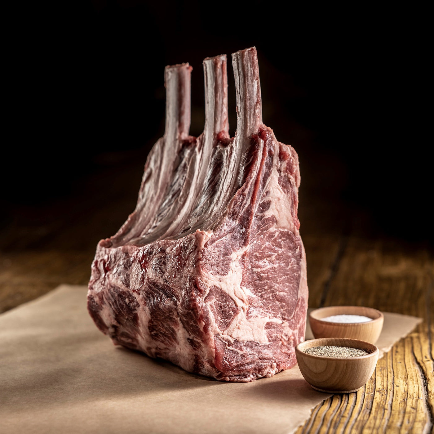 uncooked tomahawk prime rib roast bone in
